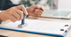 Business professional reviewing VAT reports and financial records to ensure FTA VAT compliance in the UAE.